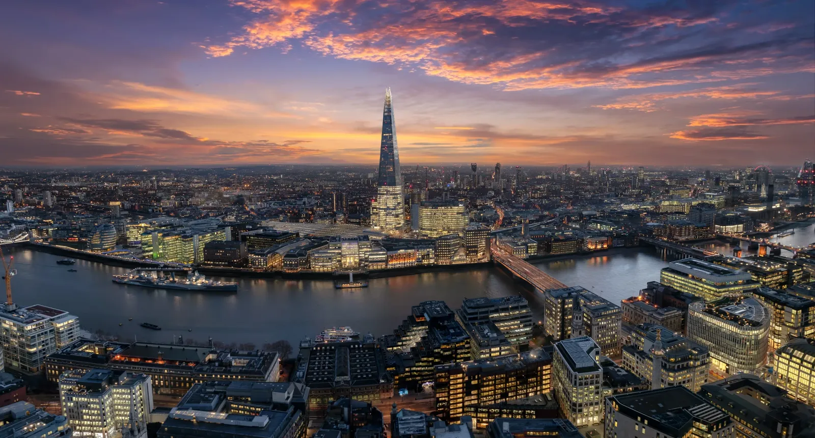 aerial view buildings against sky city sunset